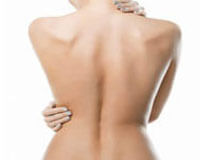 Picture of woman feeling the shape of her toned back