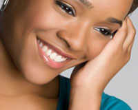 Close-up picture of a woman's face happy with her symmetrical lips